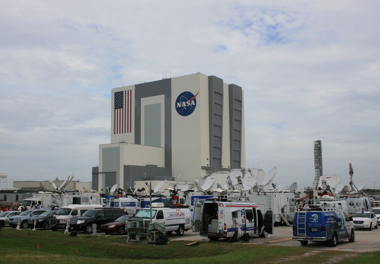 NASA launch facility with media trucks