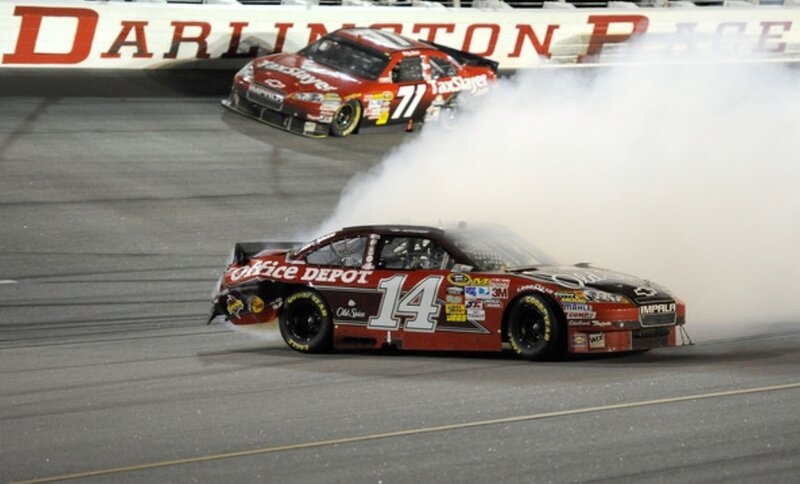 NASCAR cars racing on track