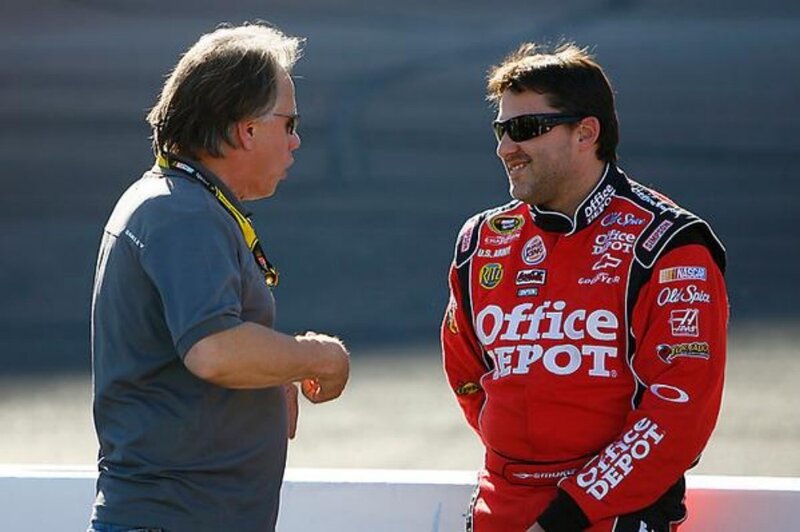 NASCAR driver talking to official
