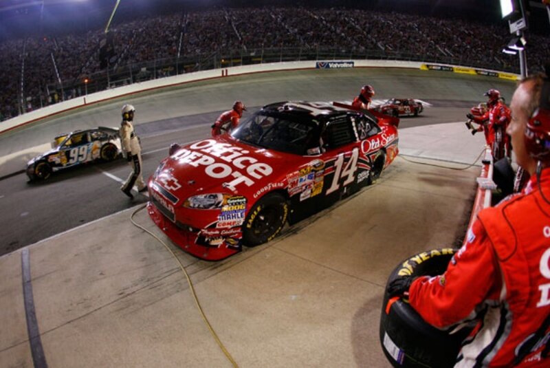 NASCAR pit stop at night