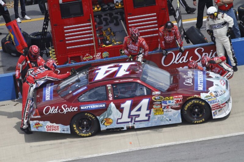 NASCAR pit stop in progress