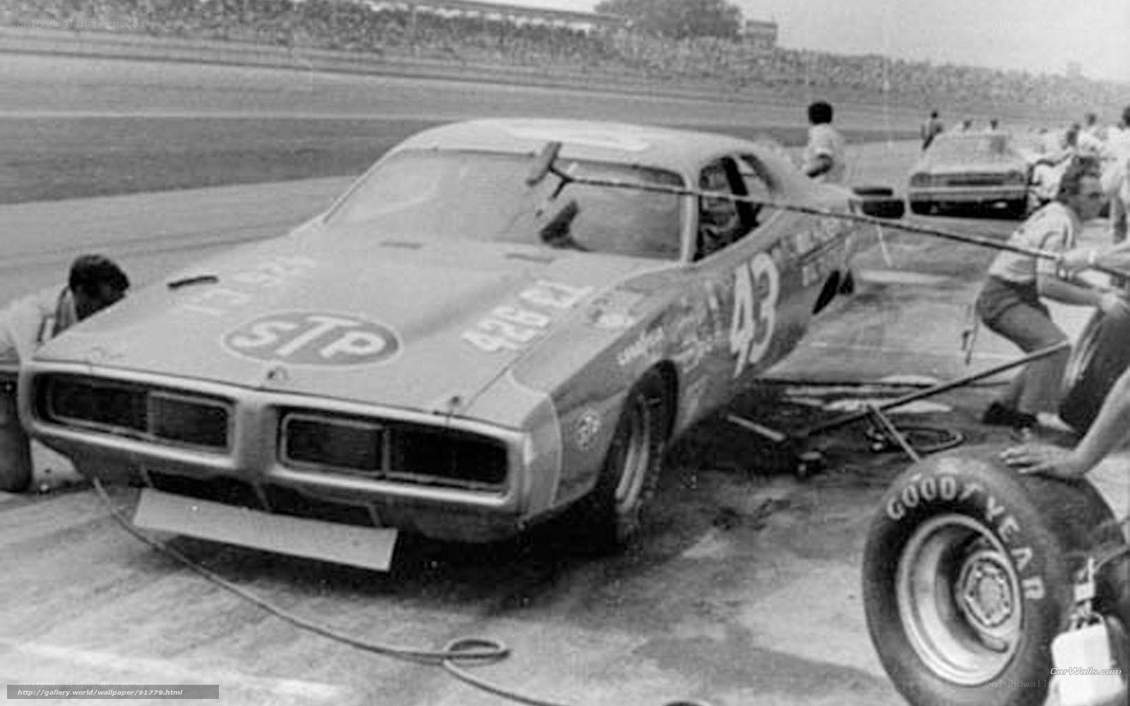 NASCAR pit stop in progress