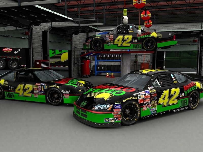 NASCAR race cars in garage