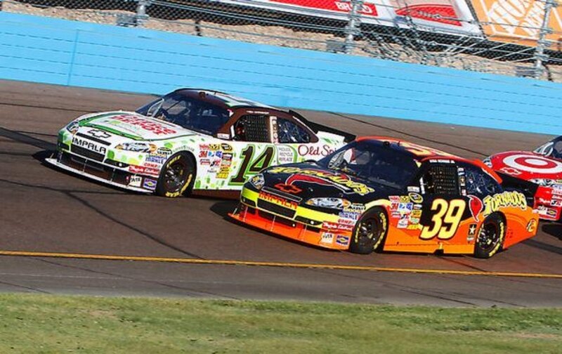 NASCAR race cars on track