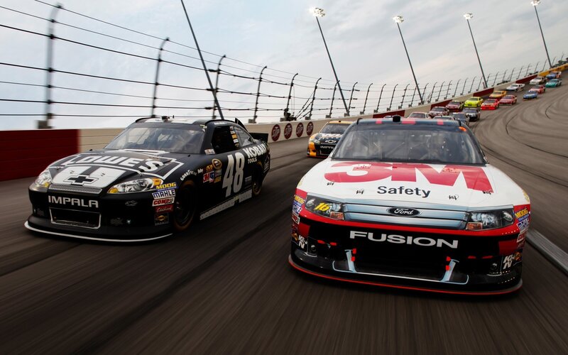 NASCAR race cars on track