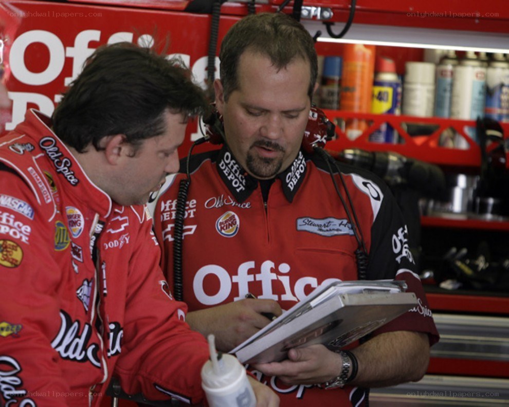NASCAR team members reviewing notes