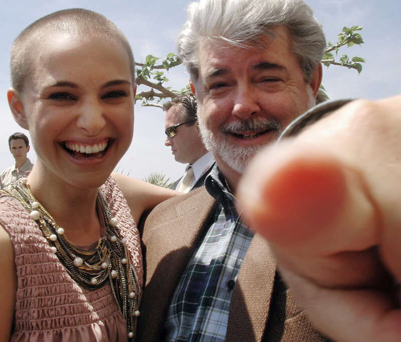 Natalie Portman and George Lucas smiling