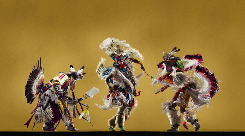 Native American dancers in traditional regalia