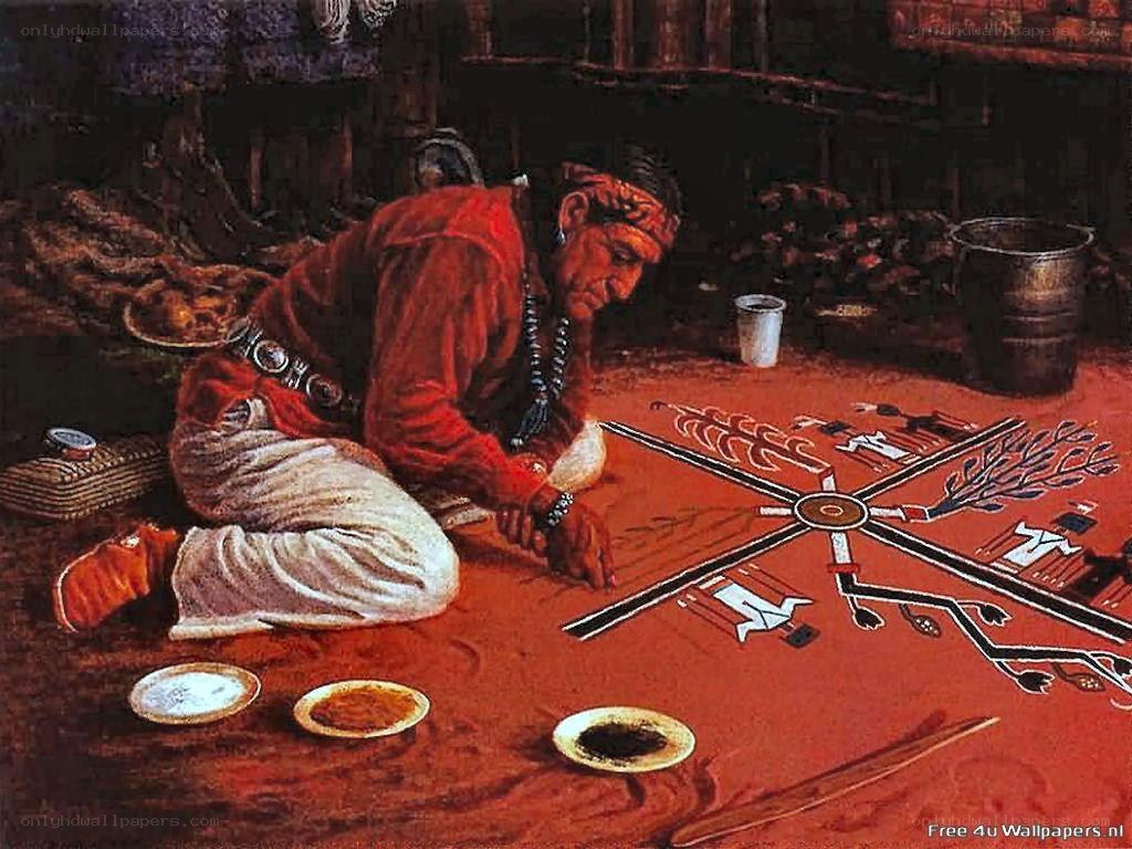 Native American man creating sand painting