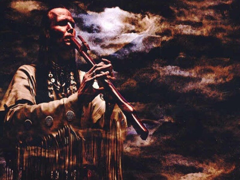 Native American man playing flute
