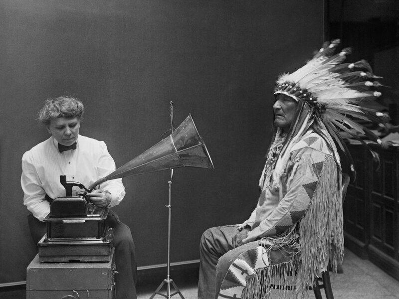 Native American man with phonograph