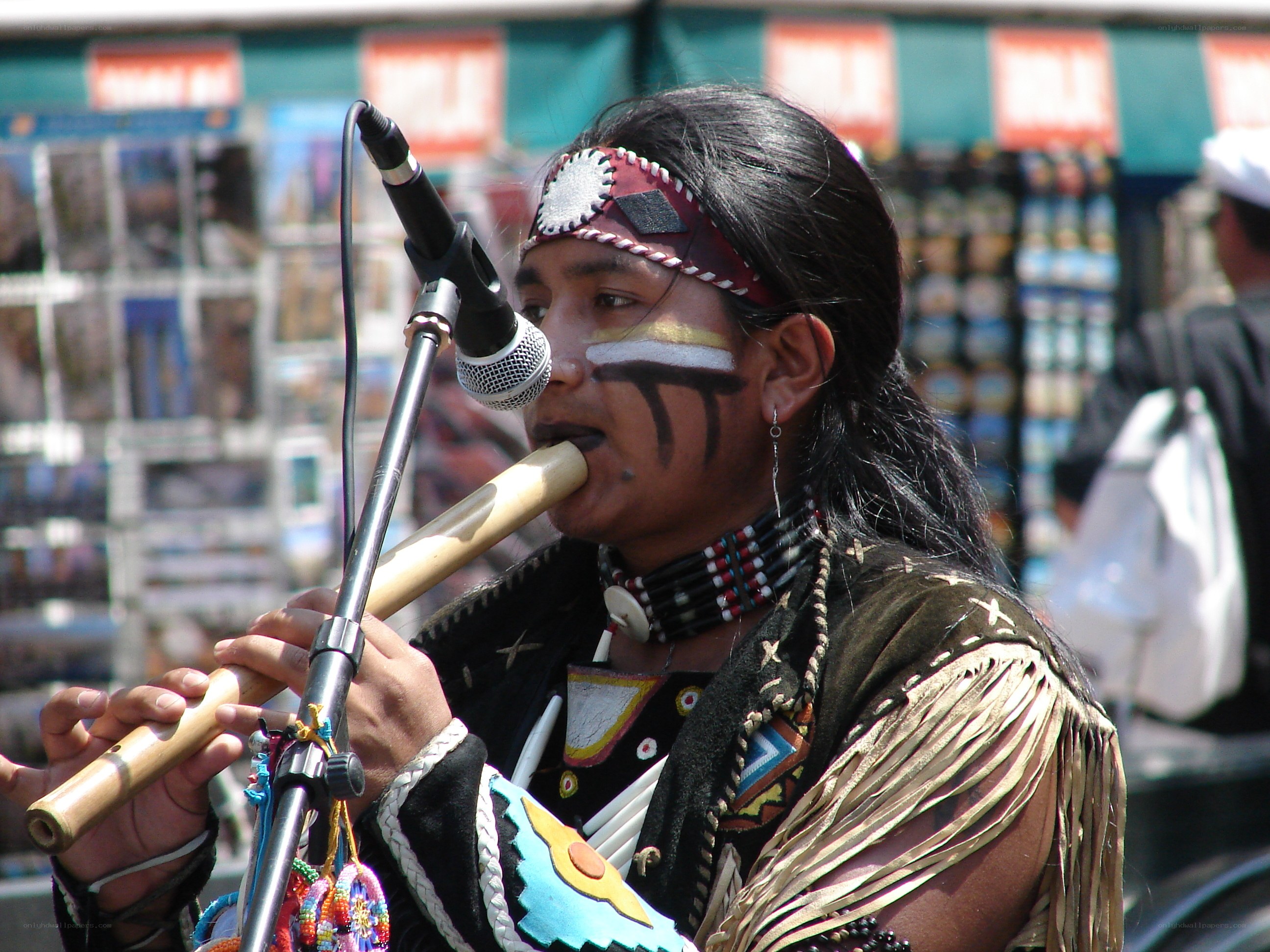 Native American musician playing flute