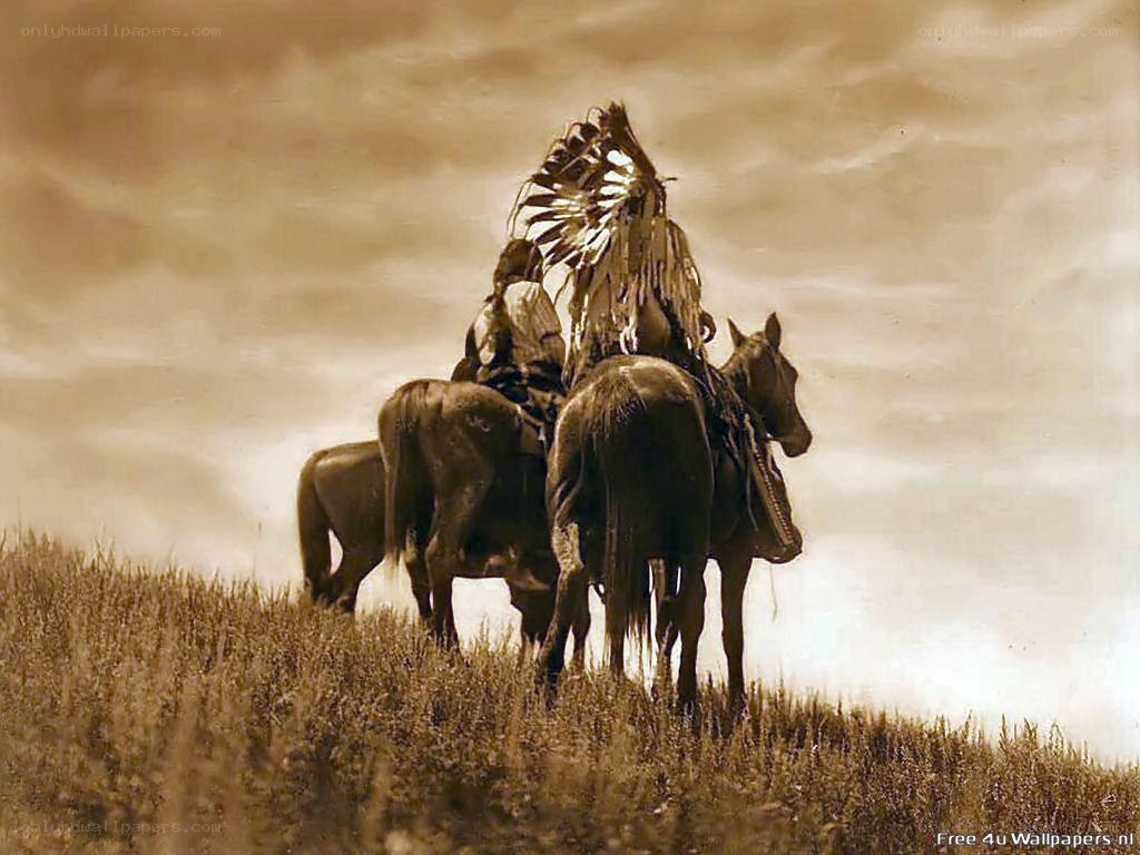Native American riders on a hill