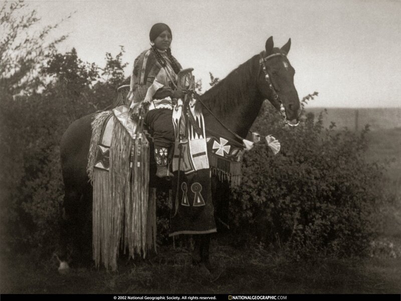 Native American woman on horseback