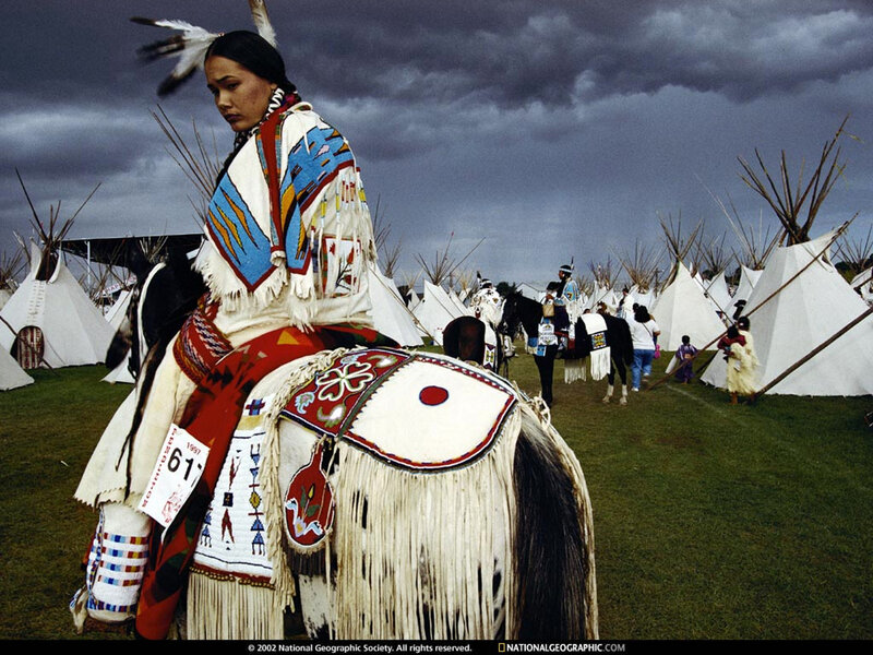 Native American woman on horseback