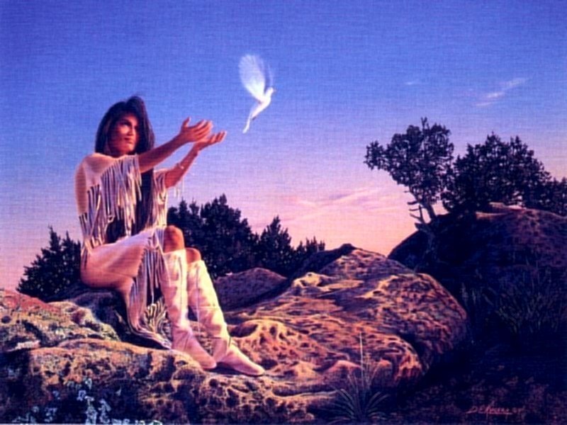 Native American woman releasing dove