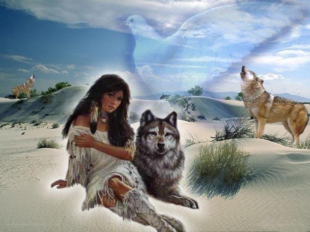 Native woman with wolves in desert