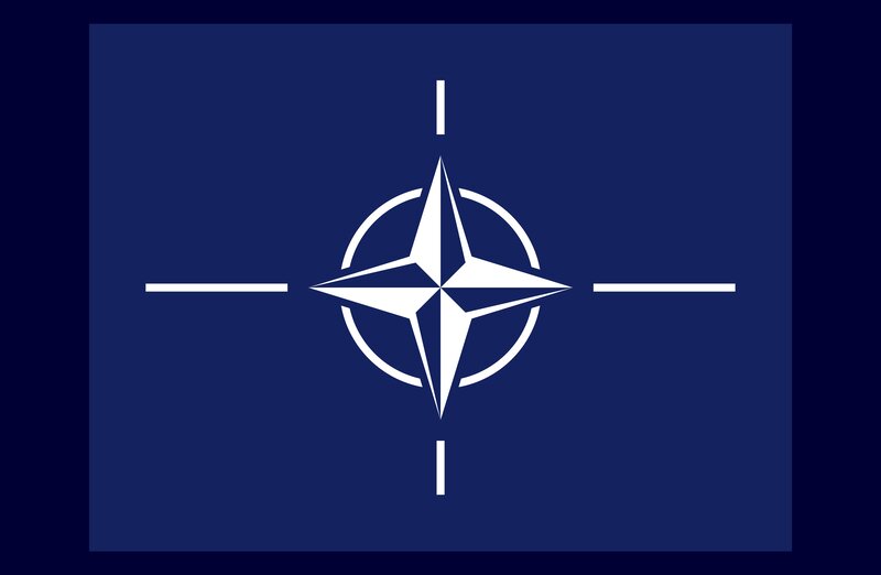 NATO flag with compass rose