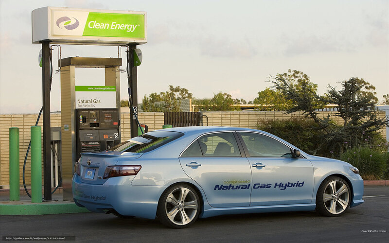 Natural gas hybrid car at fuel station