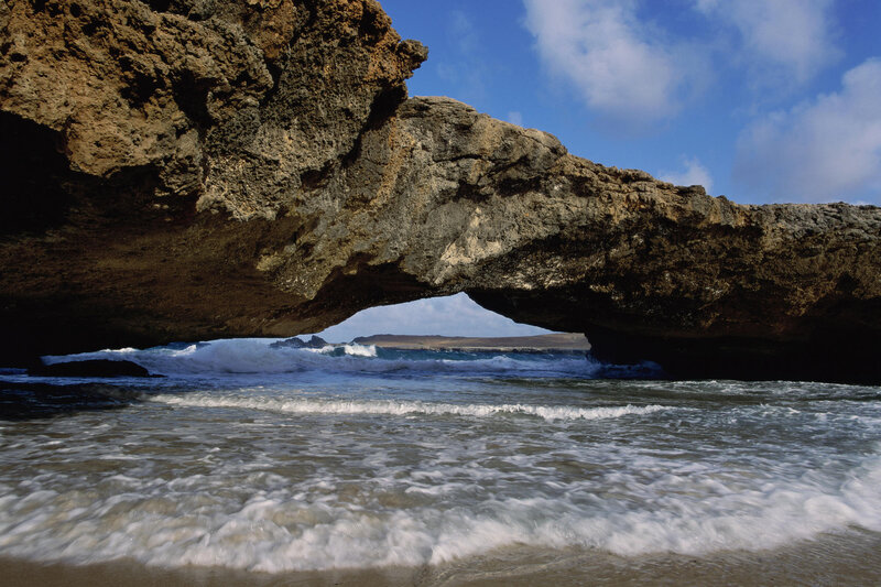 Natural Rock Arch at Beach — Blue, Dramatic, Afternoon, Photograph