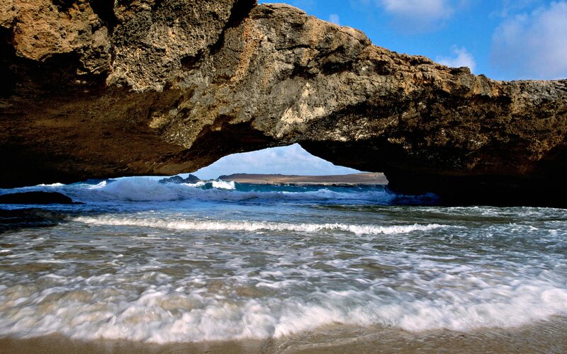 Natural Rock Arch at Beach — Blue, Serene, Afternoon
