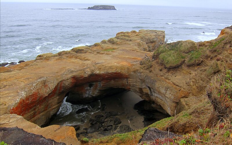 Natural Rock Arch at Coast — Brown