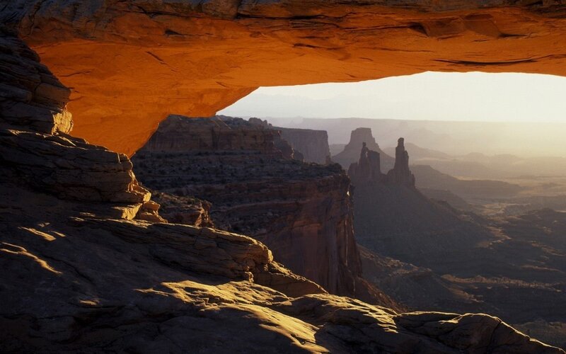 Natural rock arch at sunset