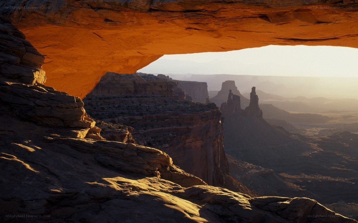 Natural rock arch at sunset