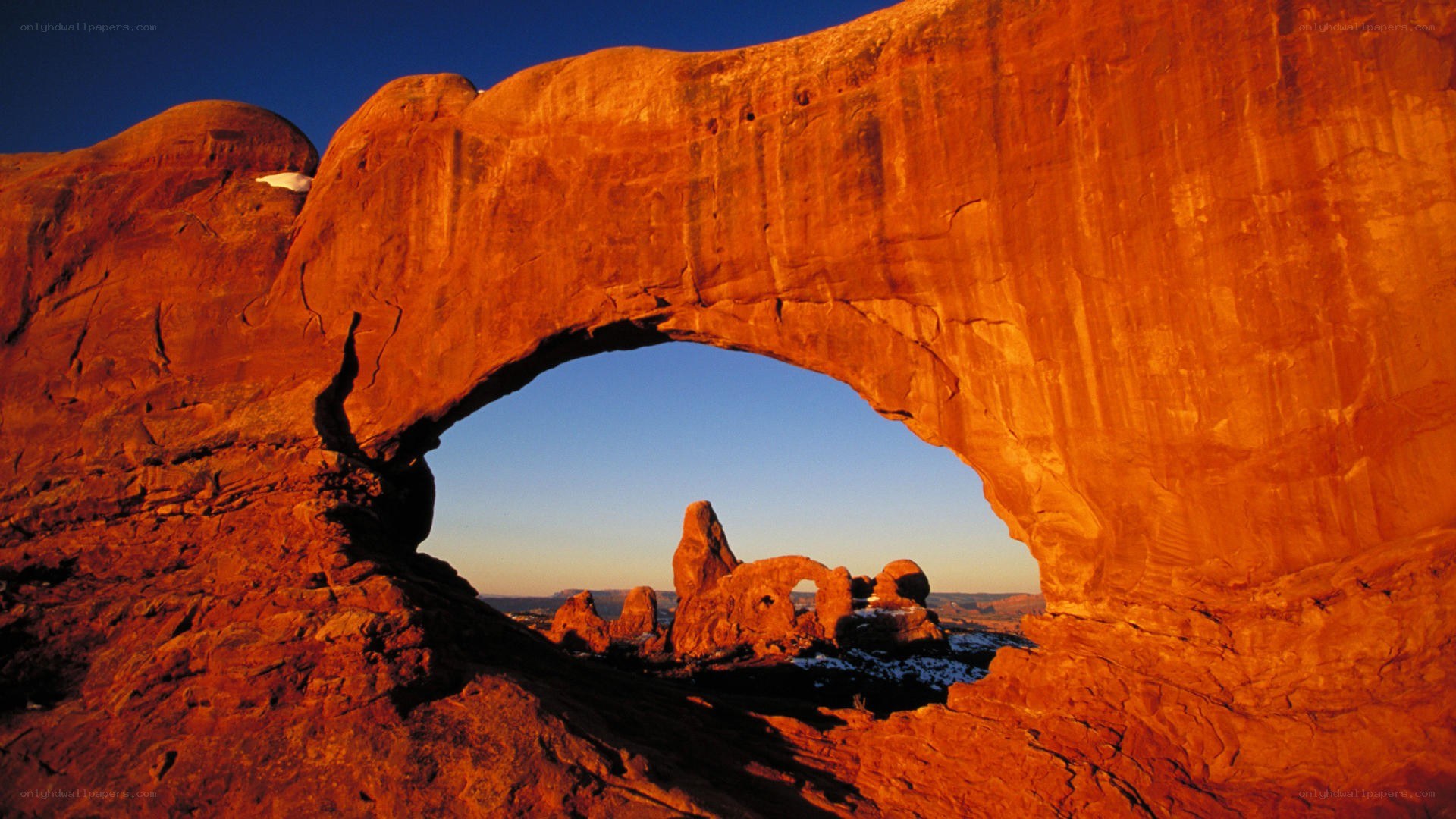Natural rock arch at sunset