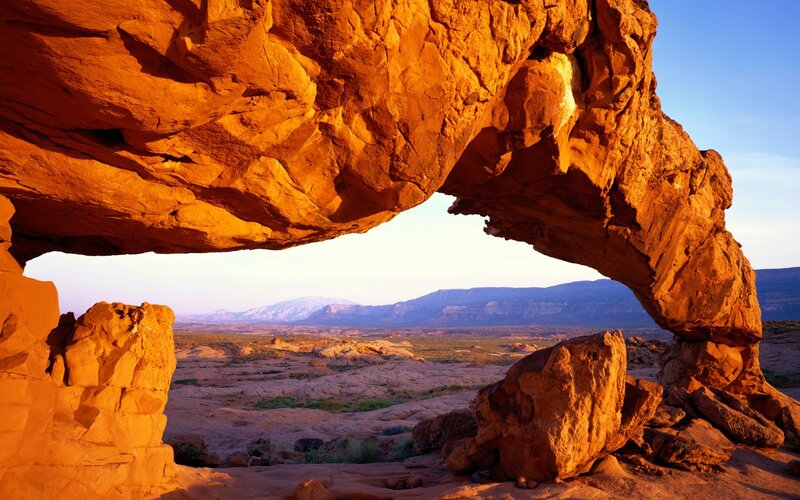Natural rock arch at sunset