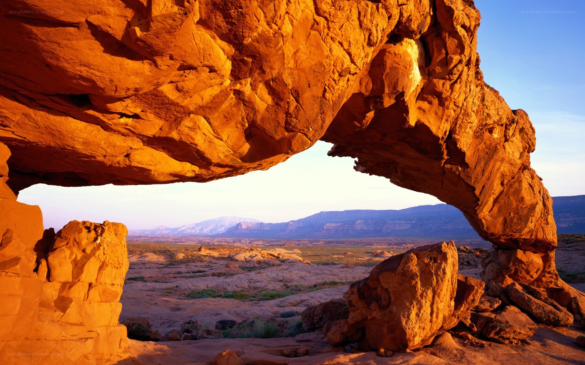 Natural rock arch at sunset