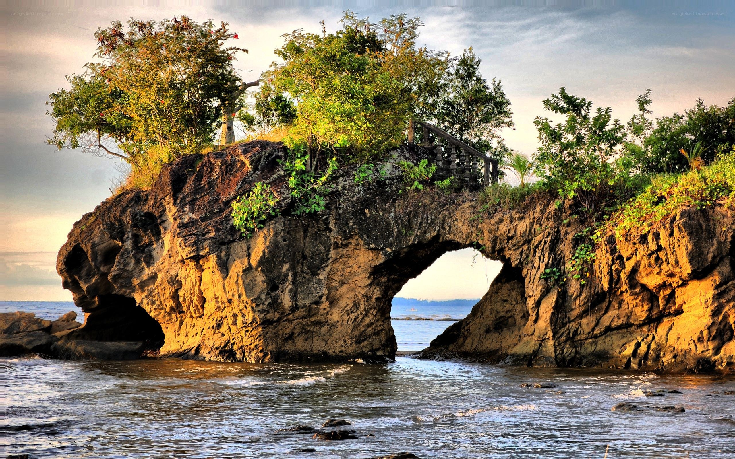 Natural rock arch at sunset