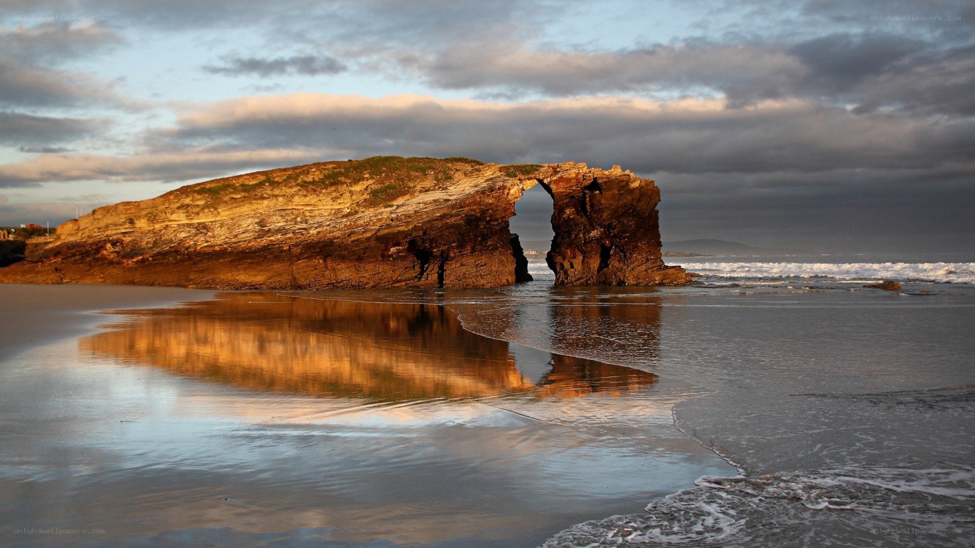 Natural rock arch at sunset