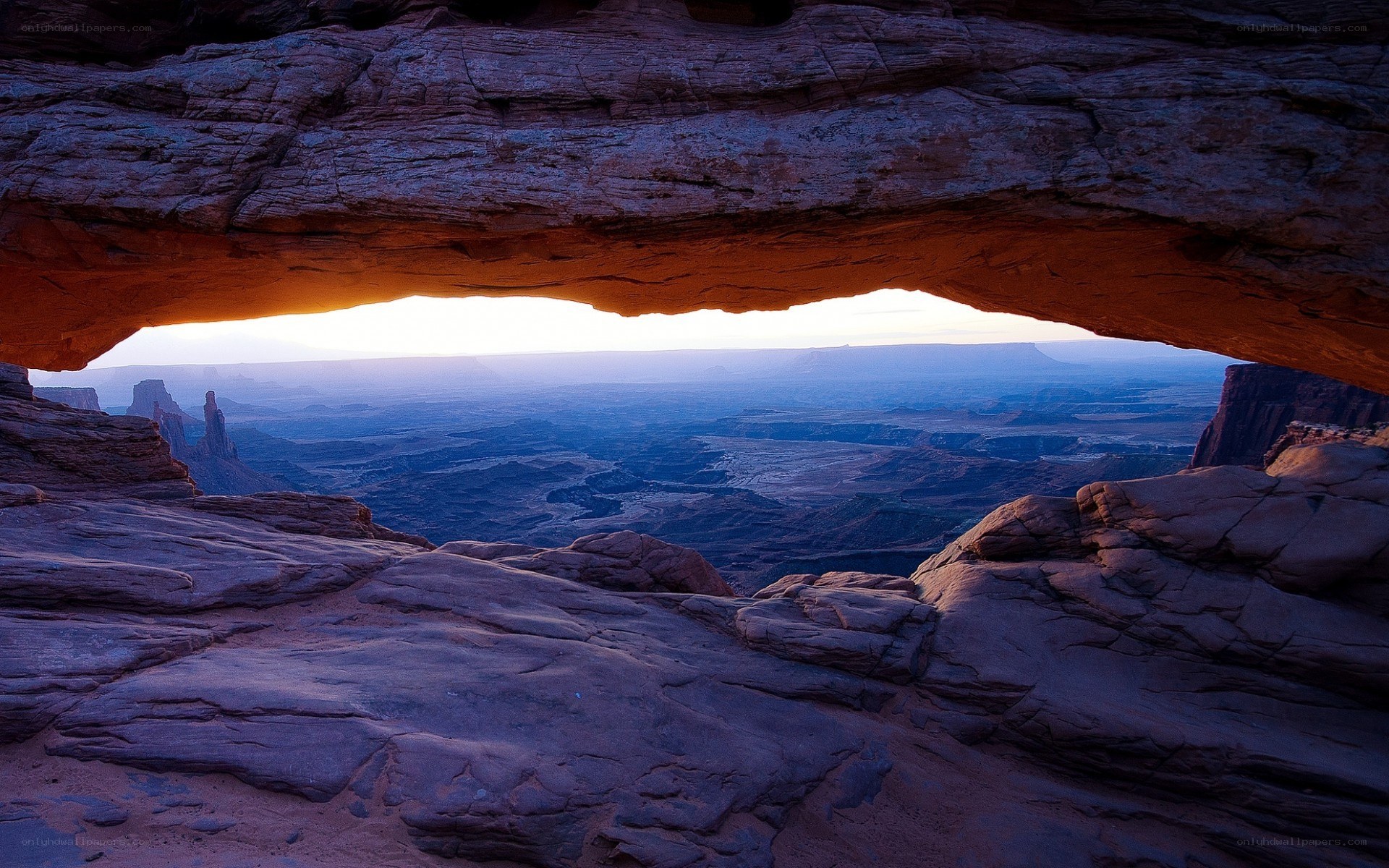 Natural rock arch at sunset