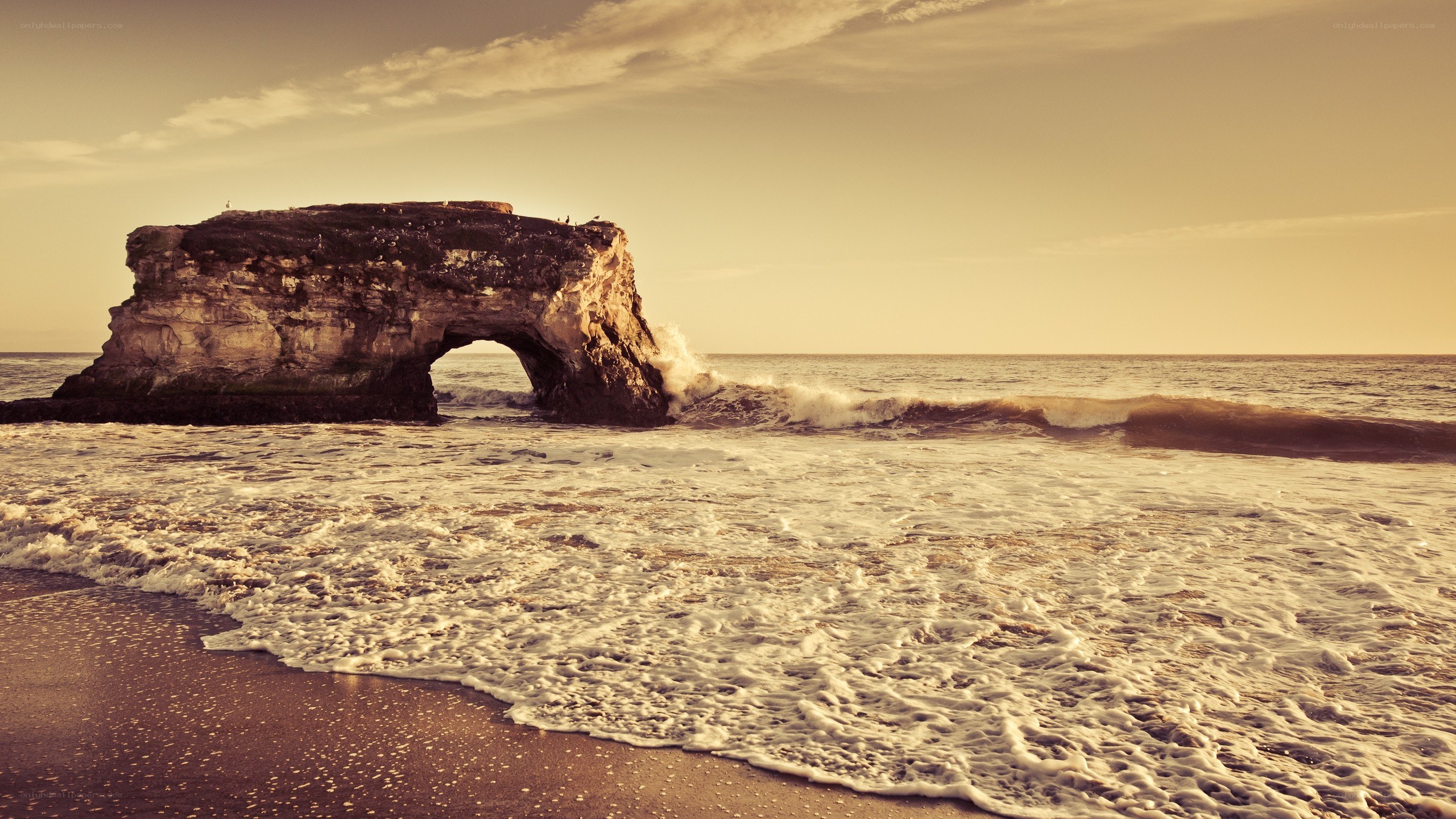 Natural rock arch at sunset
