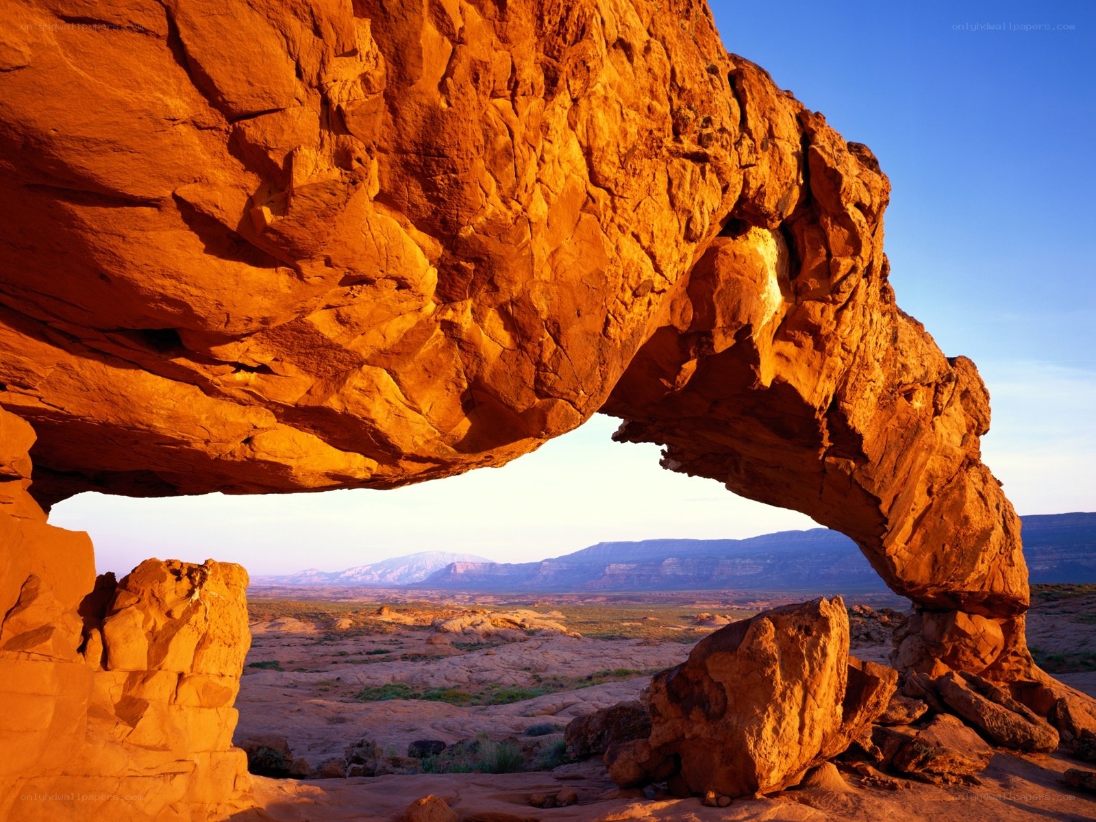 Natural rock arch at sunset