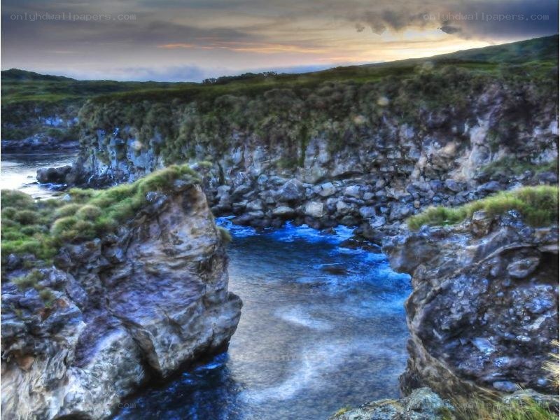 Natural rock arch at sunset