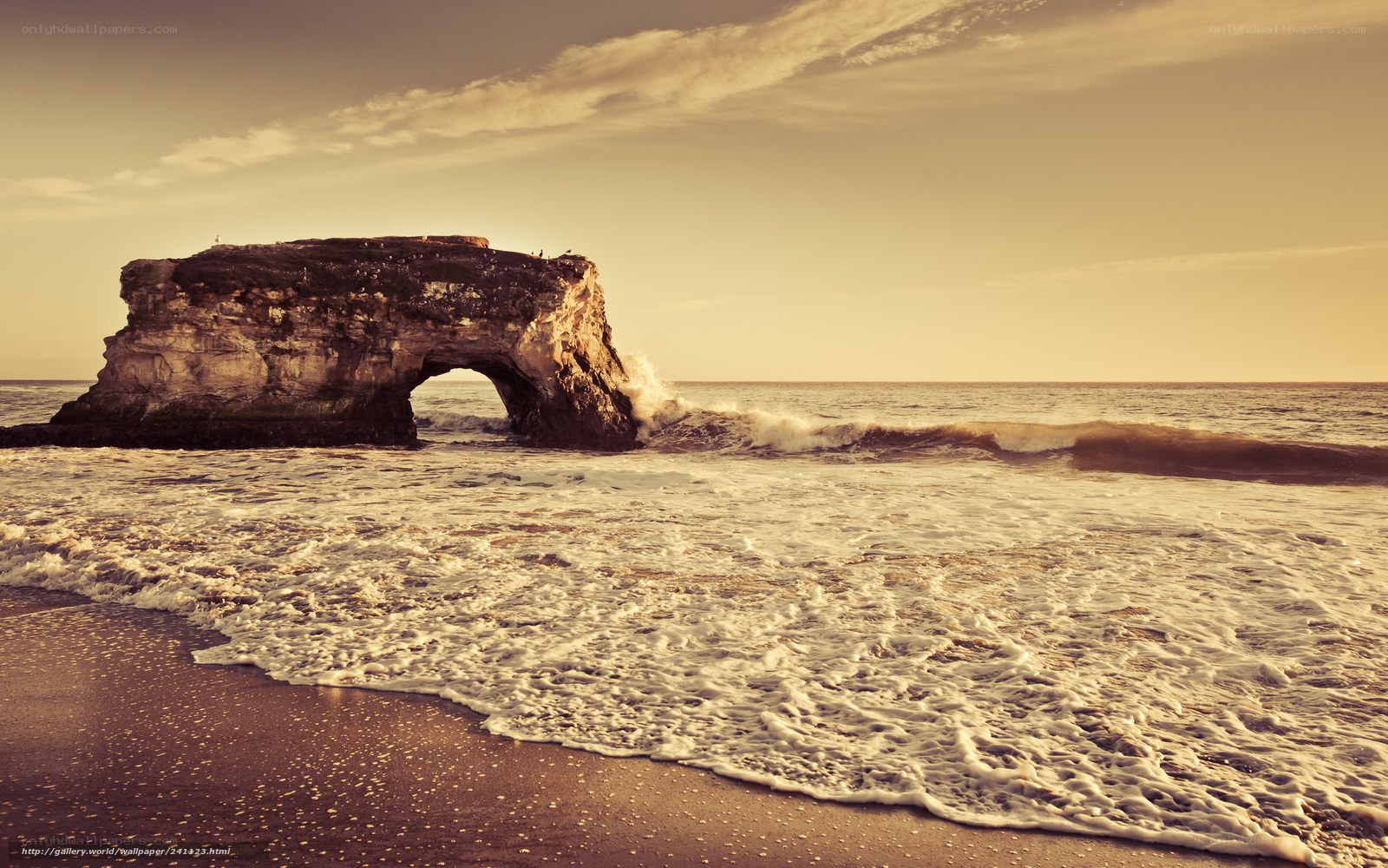 Natural rock arch at sunset