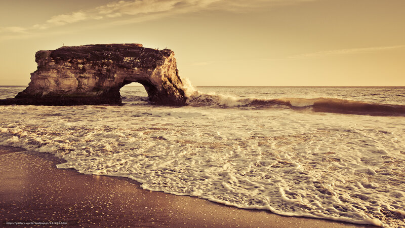 Natural rock arch at sunset