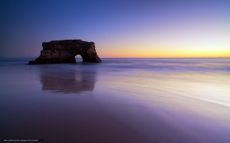 Natural rock arch at sunset