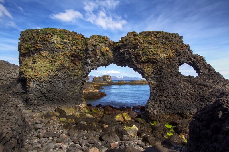 Natural Rock Arch — Blue, Serene, Afternoon, Photograph, Sea, Mountains