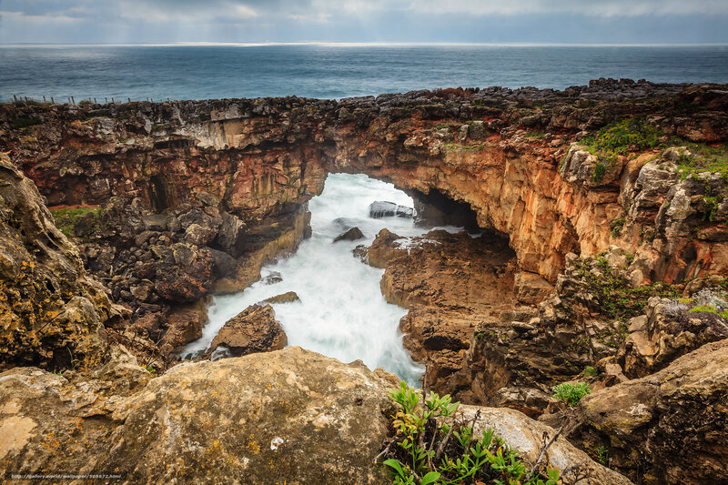 Natural rock arch by the sea