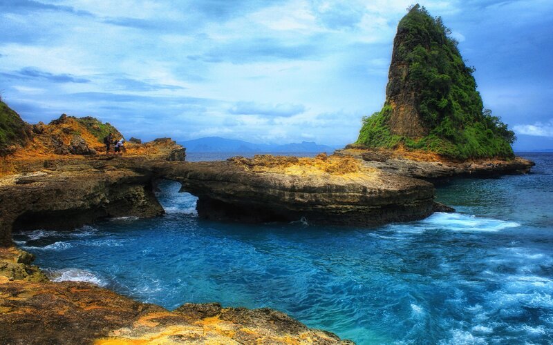 Natural rock arch by the sea
