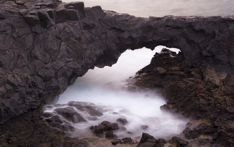 Natural rock arch by the sea