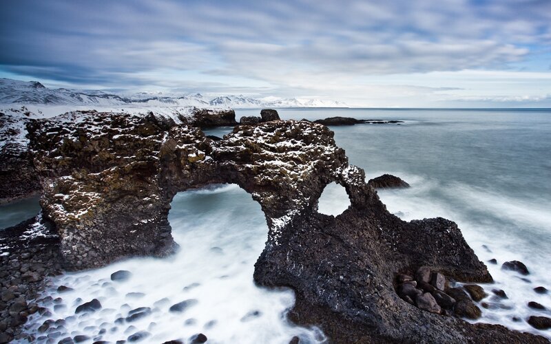 Natural rock arch by the sea