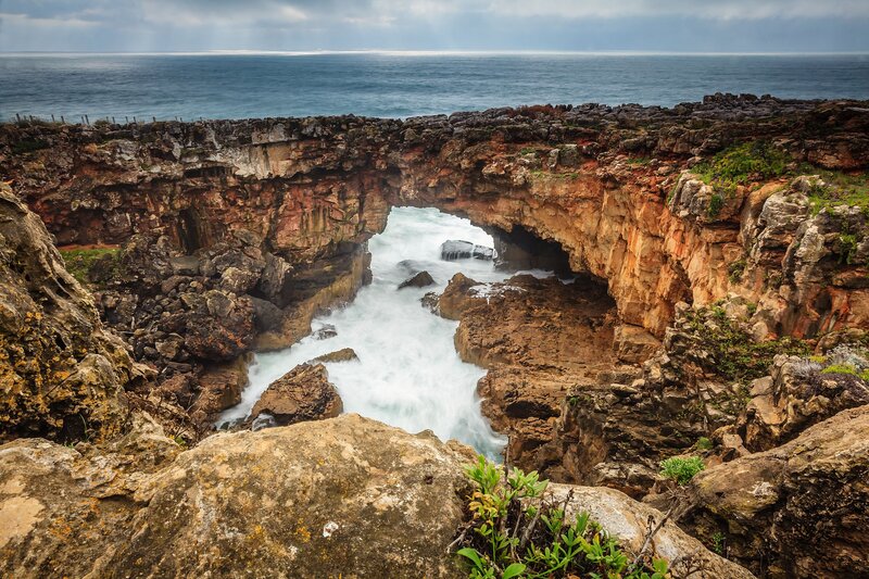 Natural rock arch by the sea