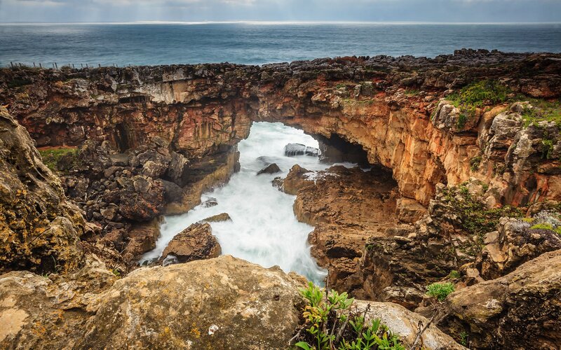 Natural rock arch by the sea