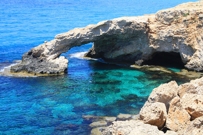Natural rock arch by the sea