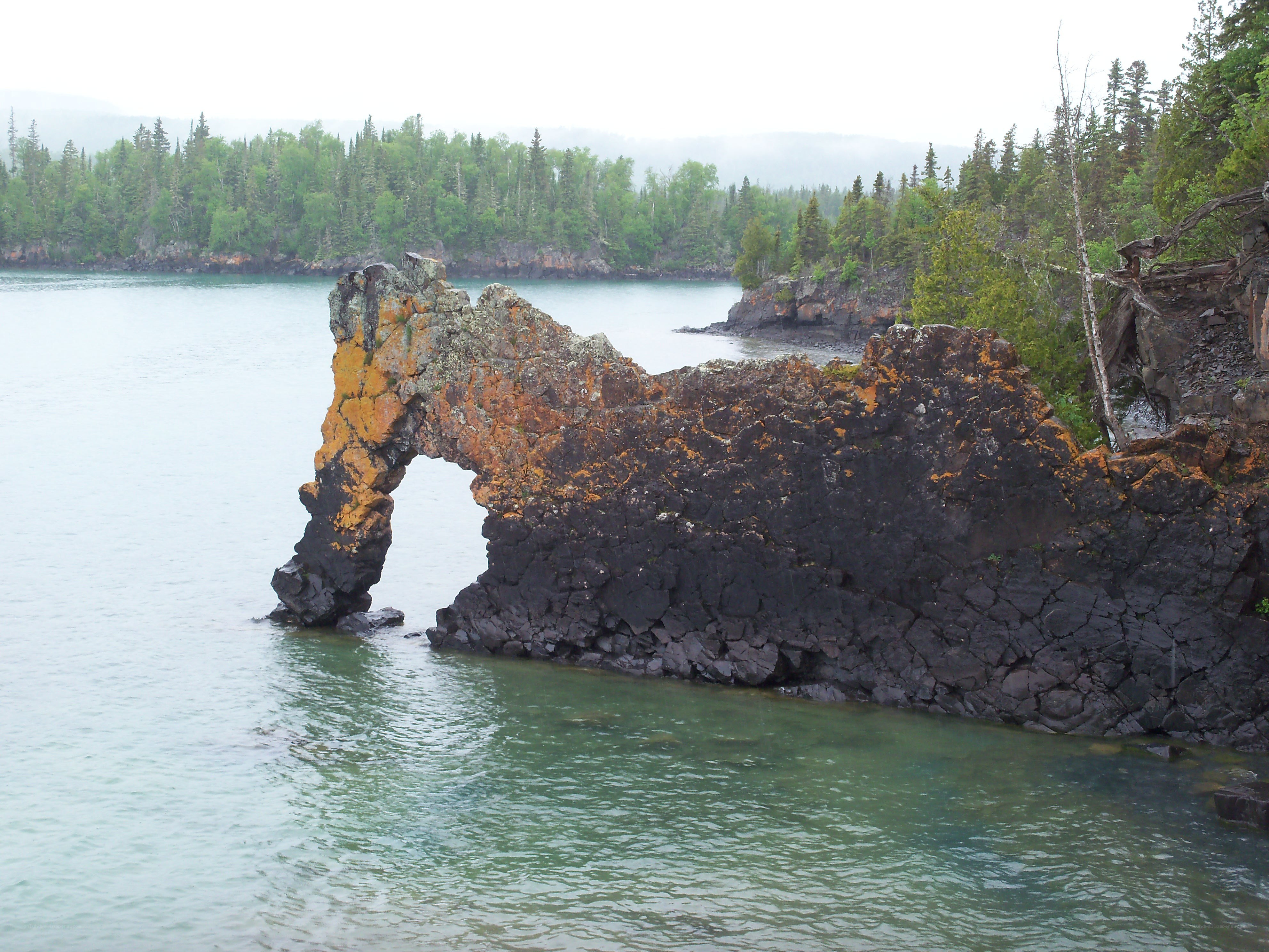 natural rock arch by the water