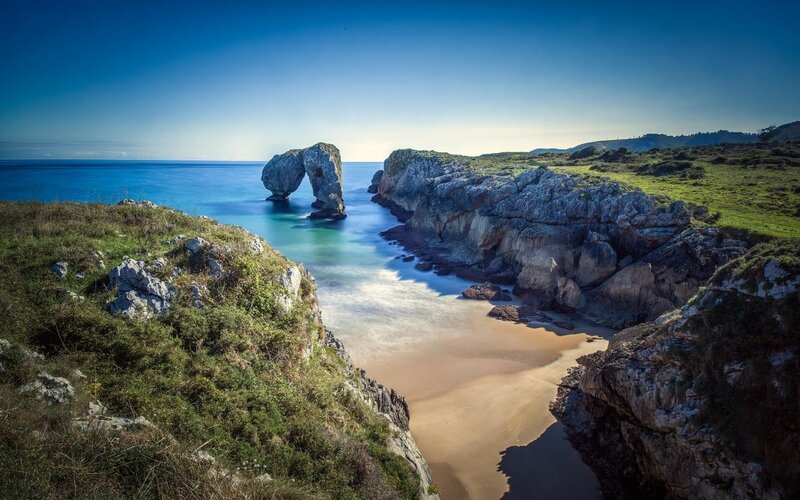 Natural Rock Arch Formation — Blue, Serene, Afternoon, Photograph, Beach